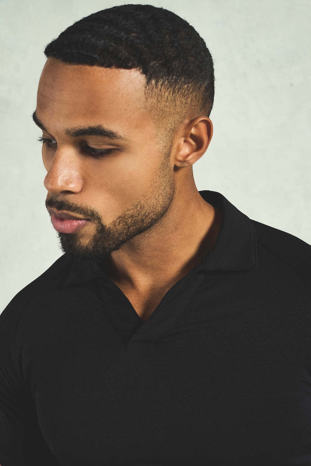 Essential Jersey Buttonless Polo Shirt in Black