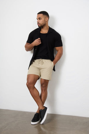 Model is 5'11 and wears a size 34W for a looser fit (31" waist, 31" inside leg)