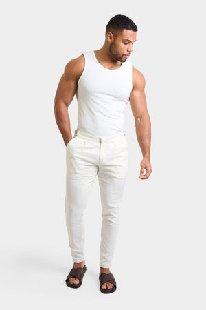 Linen Blend Cropped Pleated Trousers in Chalk - TAILORED ATHLETE - ROW