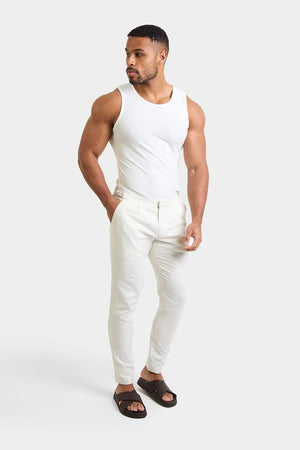 Linen Blend Cropped Pleated Trousers in Chalk - TAILORED ATHLETE - ROW