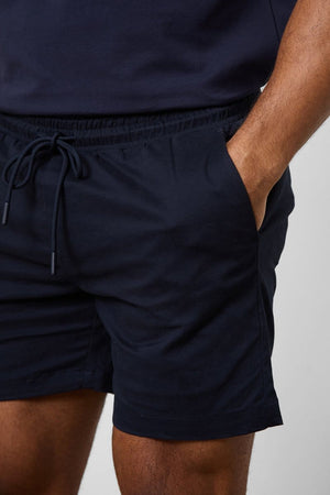 Model is 5'11 and wears a size 34W for a looser fit (31" waist, 31" inside leg)